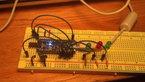This arduino nano is wired up as an ISP for the attiny (left). I also included debug LEDs that represent communication, error, and status respectively.