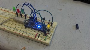 I used this 'duino as an ISP to upload a program to the attiny13a on the right. The program makes the tiny blink the yellow LED on and off.