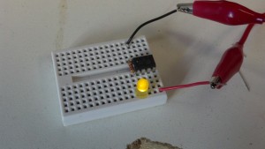 Detached from the arduino, the tiny still runs the program to blink a yellow LED on and off.
