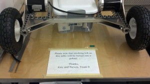 A sign warns students against crowding our table with personal belongings.