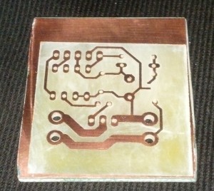 After I etched the board and acetoned off the paint, I drilled holes in the PCB.